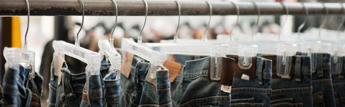 jeans hanging on a sales rack