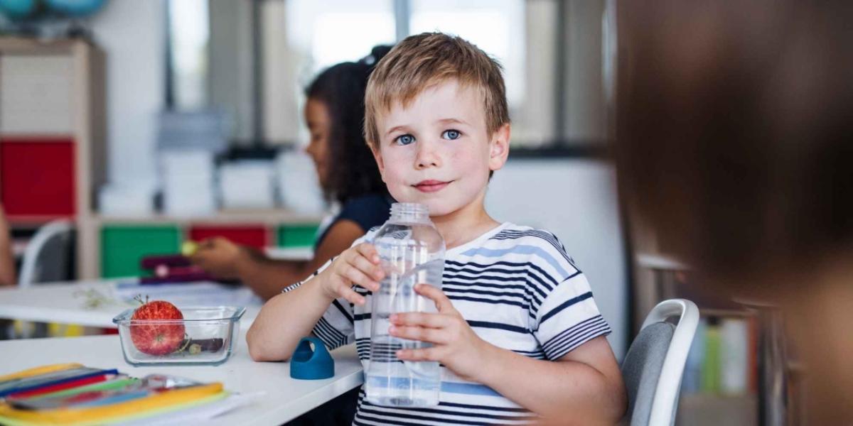 Delos:  Boy with water bottle. 