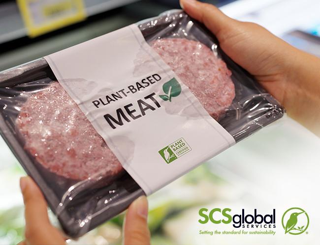 Person holding plant-based meat package